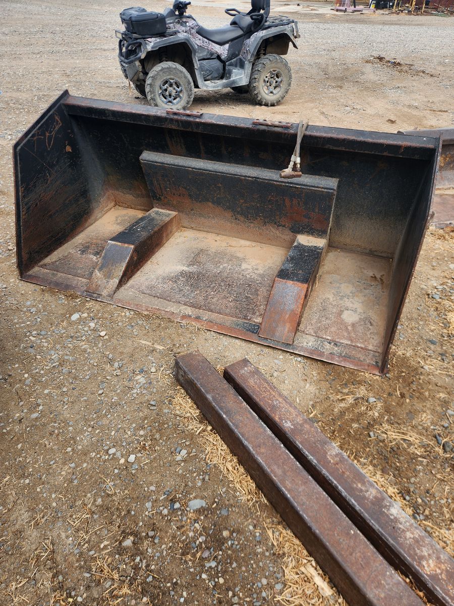 Aim Roll Out Skid Steer Bucket