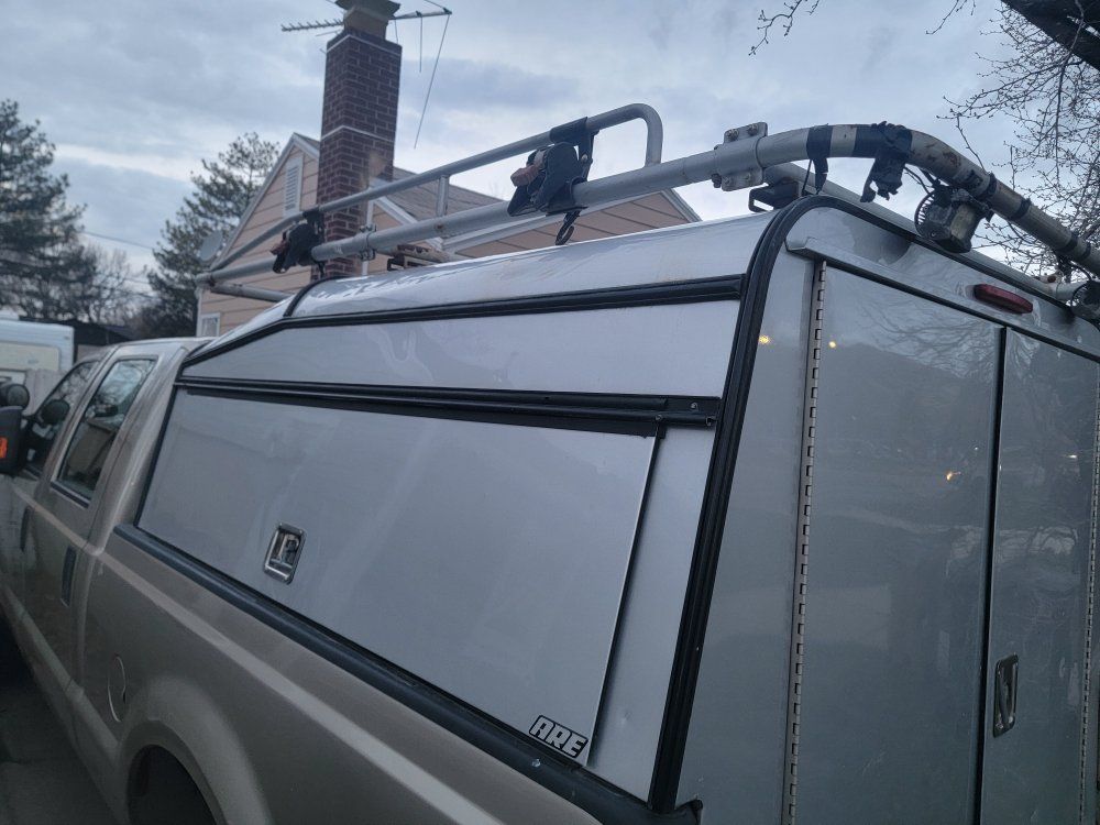 ARE truck shell utility box with ladder rack.