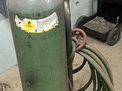 Oxygen tank with gauges and hoses.