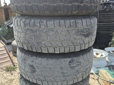 5 All Terrain LT285/75R16 Tires on Black Steel Wheels 8 on 6.5