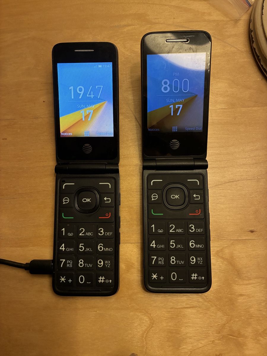 Two At&t flip phones