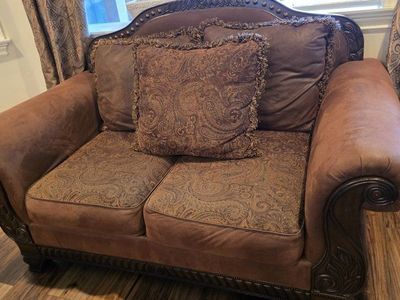 Traditional Brown Accent Loveseat with Ornate Carved Wood Trim and Paisley Cushions