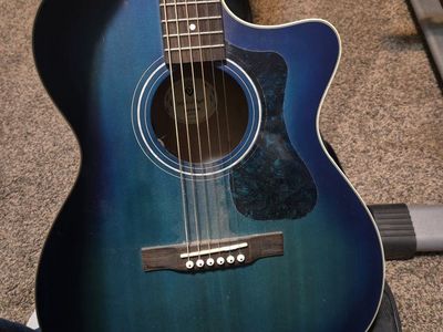 Guild OM-240CE Blue Acoustic Guitar.