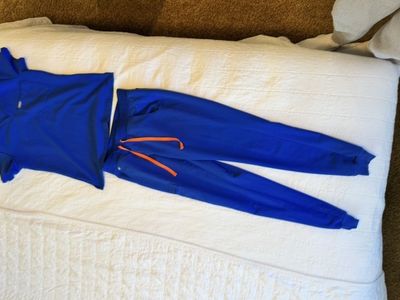 Five Pairs of FIGS Scrub Set Top and Jogger Pants Blue and Black