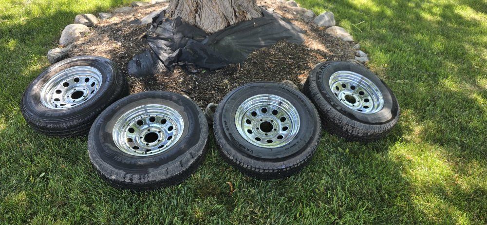 Set of 4 205/75R14 trailer wheels and tires. Load Range C. 5x4.5