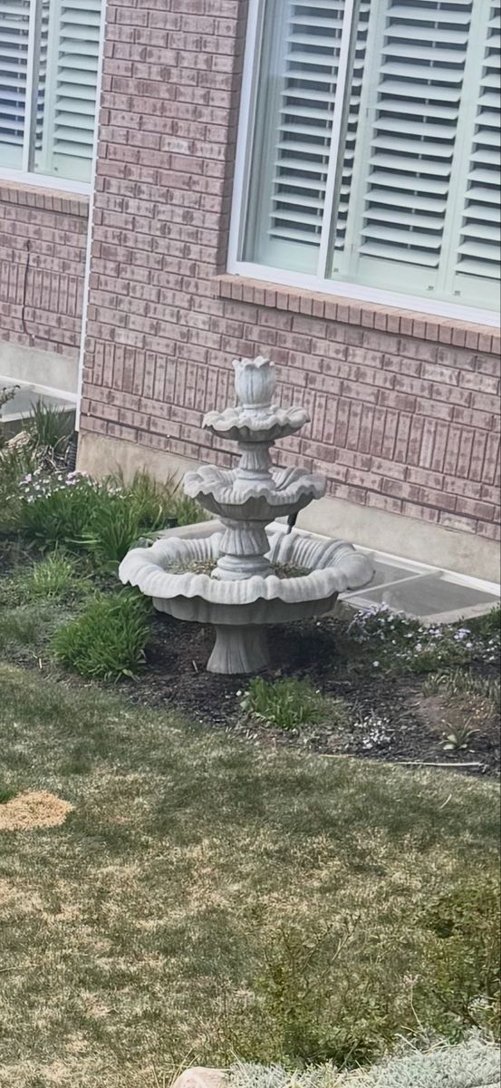 Two identical stone fountains
