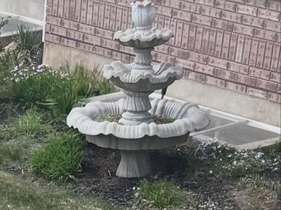 Two identical stone fountains