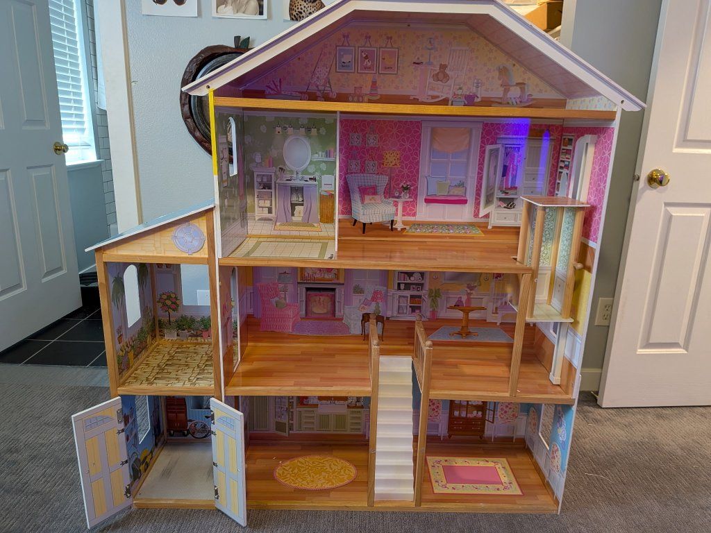 Barbie House with cars, Barbies, and accessories