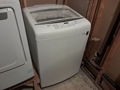 LG top load washer in white,