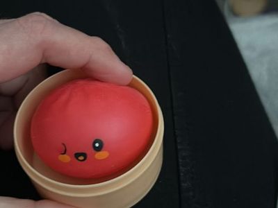 Kawaii Red Dumpling Stress Ball Fidget Toy in Steamer Basket Container