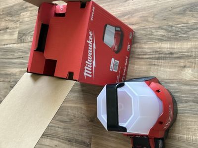 Milwaukee power tools, chargers, and light with hard case