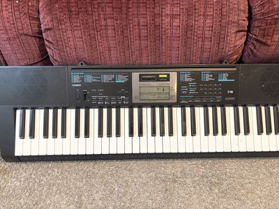 Black Casio LK-170 61-key portable keyboard featuring a key-lighting system and a central LCD contro