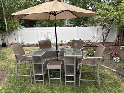 Must go……. Outdoor Patio Bar Set: Glass-Top Table, 5 Chairs & Umbrella with Stand. chairs do have some sun fading. OBO