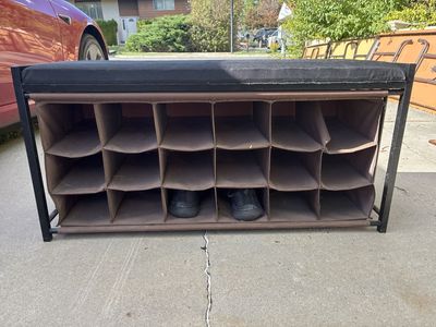 Metal Frame Shoe Storage Bench with Black Cushion and Brown Cubbies