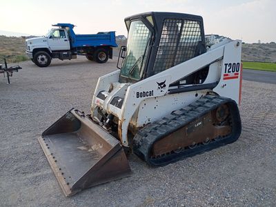 2001 Bobcat T200 Skid Steer Package w/ Attachments + Iron Bull 21' Trailer