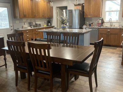 All wood Trestle table 3 Butterfly leaves and 8 Slatback side chairs