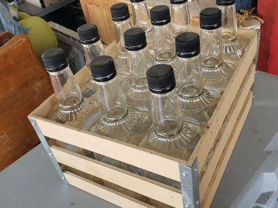 hand crafted create with whiskey bottles