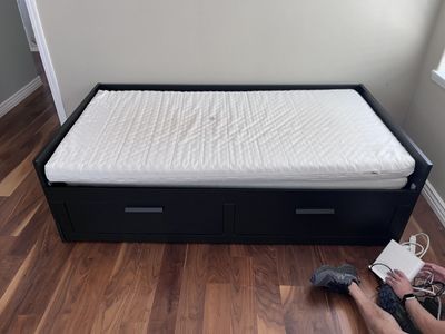 A black IKEA day bed