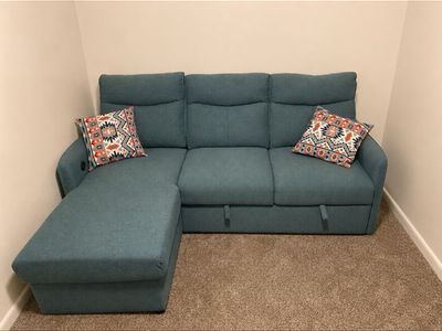 Blue/Green Fabric futon with Storage Chaise and Pull-Out Bed