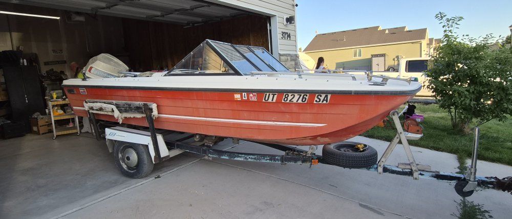 Vintage Seaswirl Motorboat with Outboard Evinrude Motor and Trailer