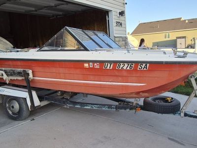 Vintage Seaswirl Motorboat with Outboard Evinrude Motor and Trailer