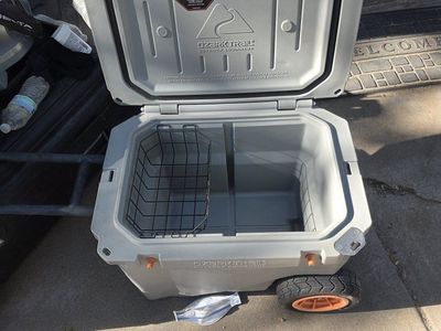 The Ozark Trail 45 Qt High Performance Hard Sided Rolling Cooler shown in the image typically ranges in value from $130 to $175