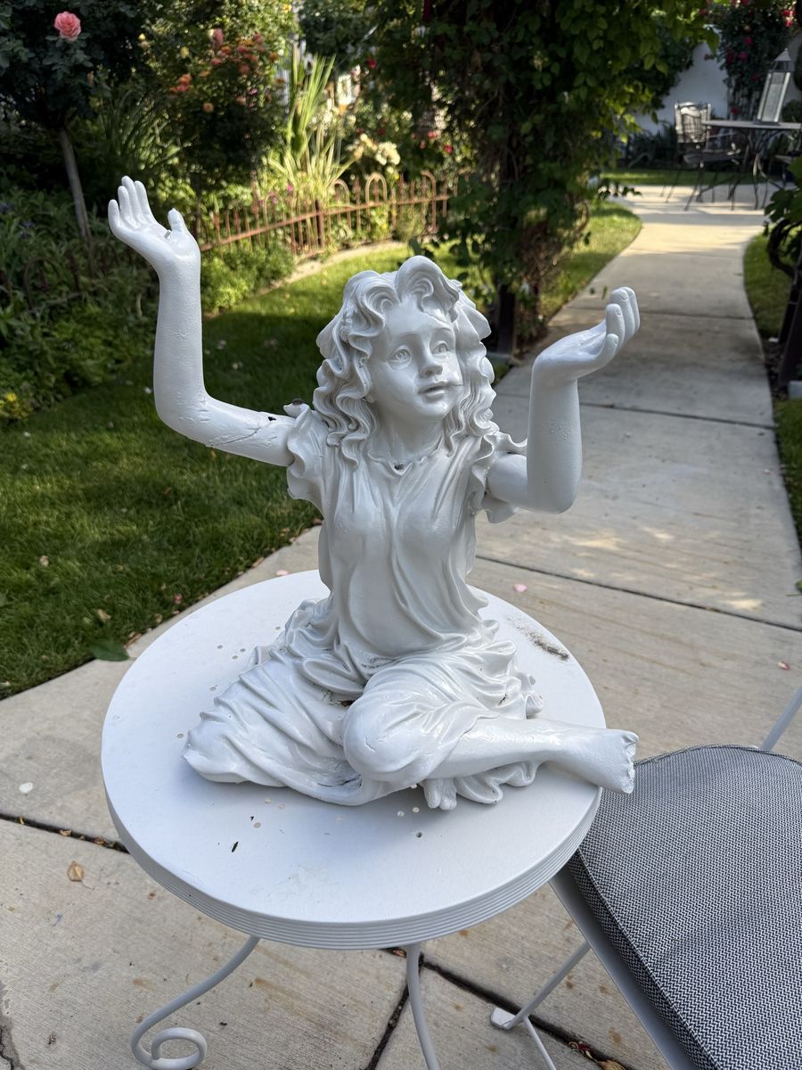 Garden girl statue 20” T 16” W does have damage.