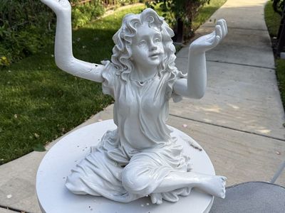 Garden girl statue 20” T 16” W does have damage.
