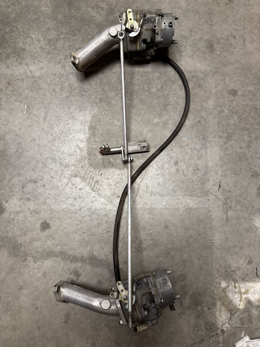 Dual Carburetor Setup with Intake Manifolds and Throttle Linkage