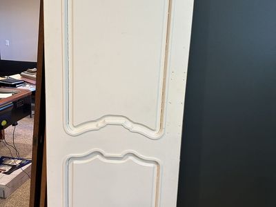 Quality solid wood interior doors removed during a remodel. These are not hollow-core or MDF—they are solid wood construction.