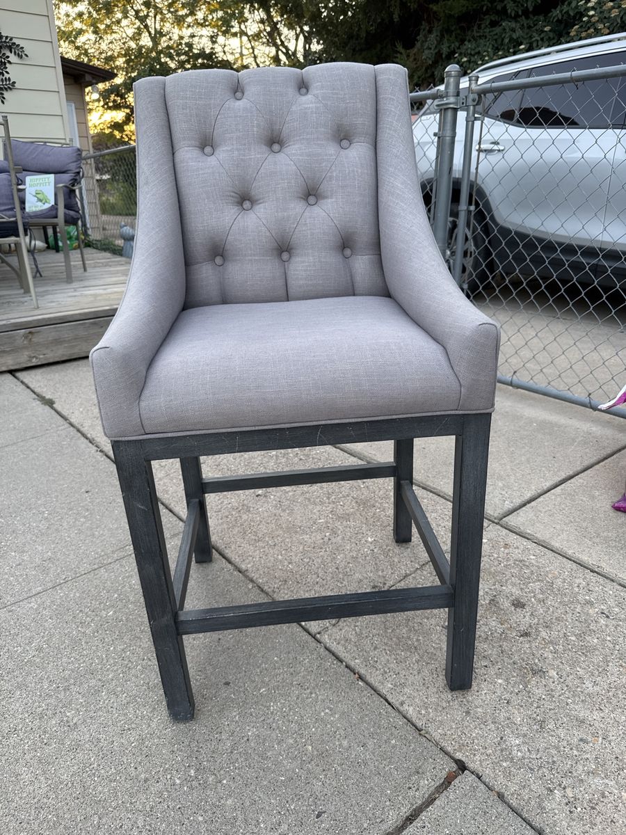 Grey tufted chair