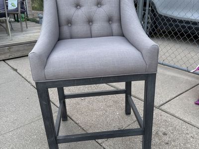 Grey tufted chair