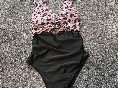 Size Medium women’s 1 piece swim suit.