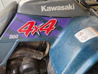 Kawasaki 4x4 300cc ATV with blade and lift