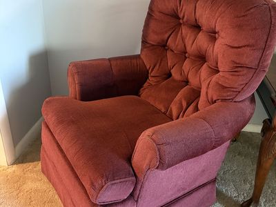 Red rotating arm chair