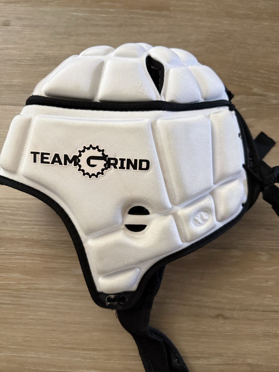GameBreaker PRO Soft Shell Protective Helmet, customized with a "Team Grind" team logo.