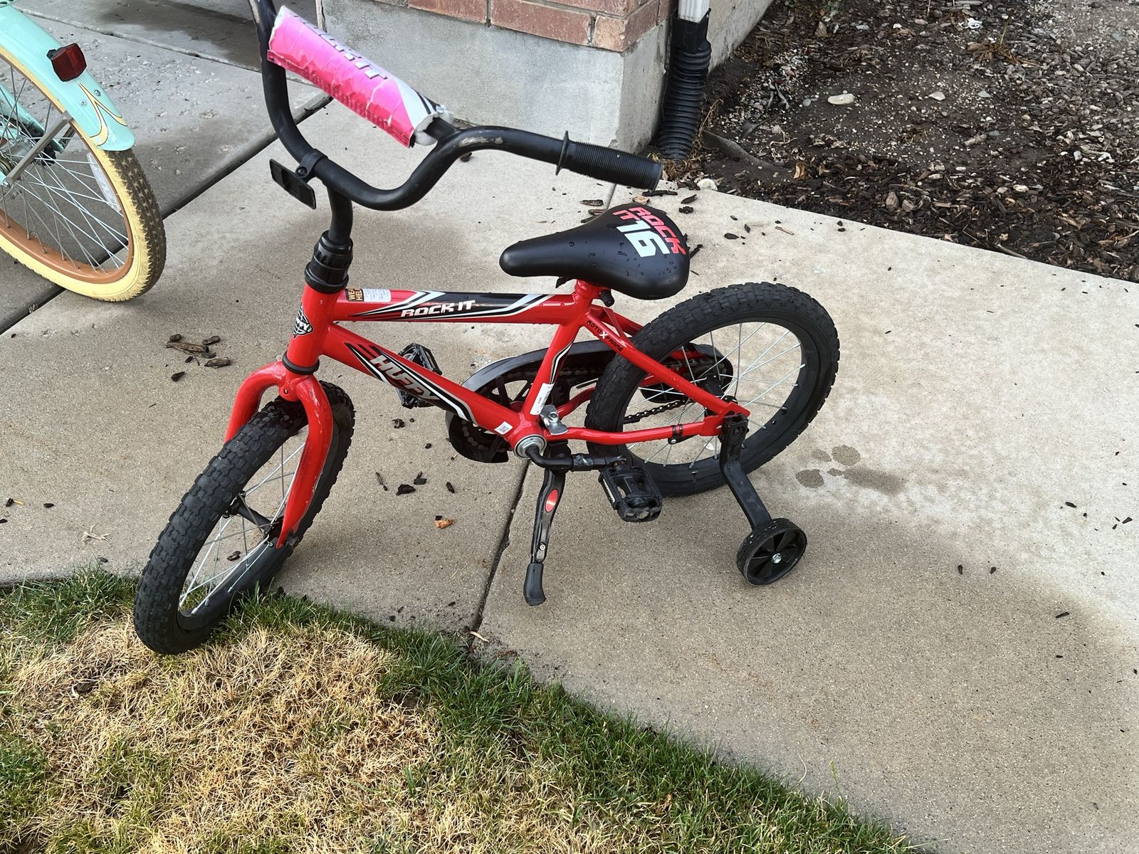 Boys Huffy Rock-it bike with removable training wheels.