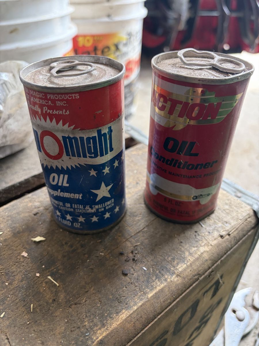 Two vintage automotive addictive cans