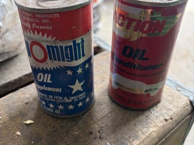 Two vintage automotive addictive cans