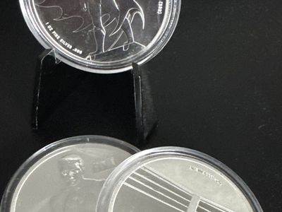 3oz .999 fine silver Batman and Muhammad Ali coins.