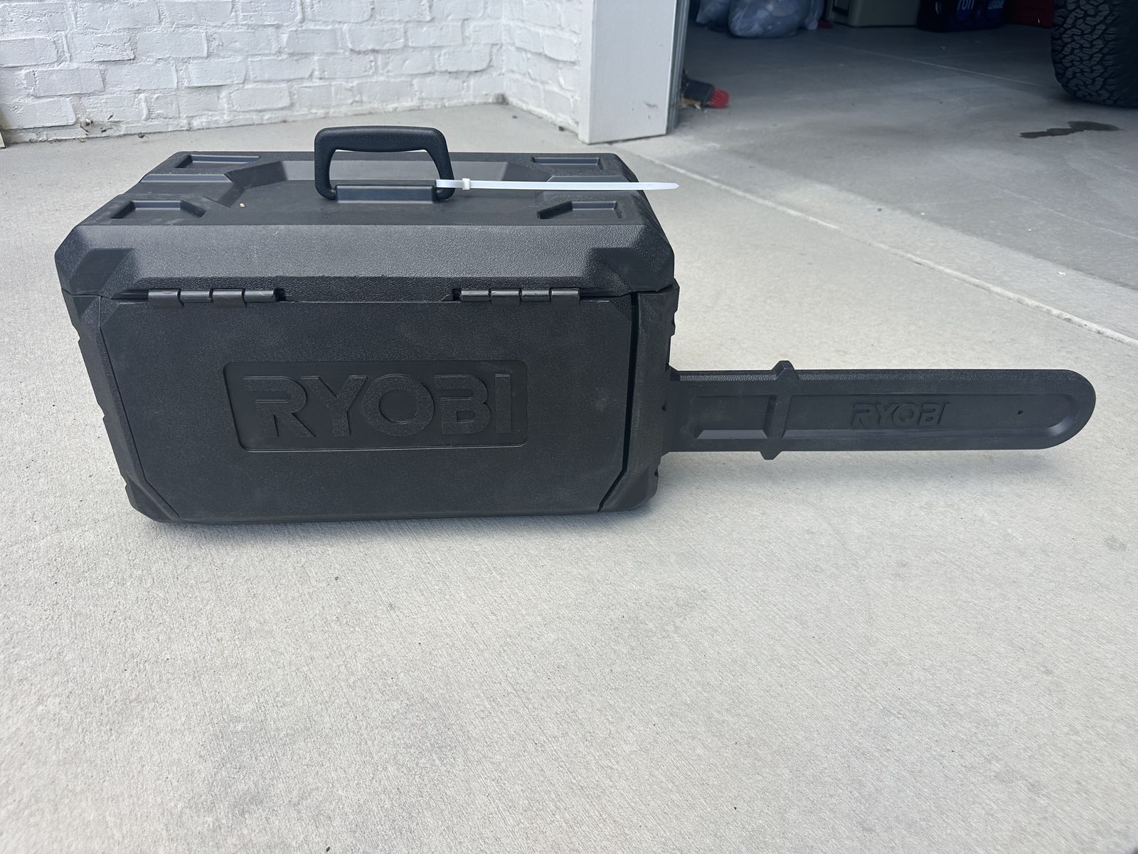 NEW RYOBI 20-inch 40V Brushless Cordless Chainsaw with Case, Charger, and Manuals