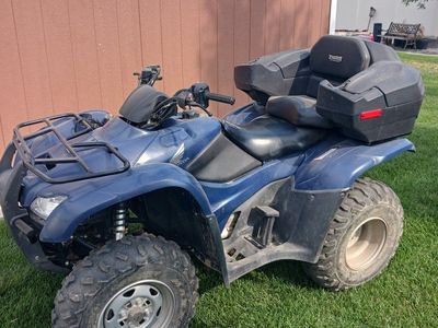 Two Honda Rancher ES ATVs and Echo Trailer for transporting.