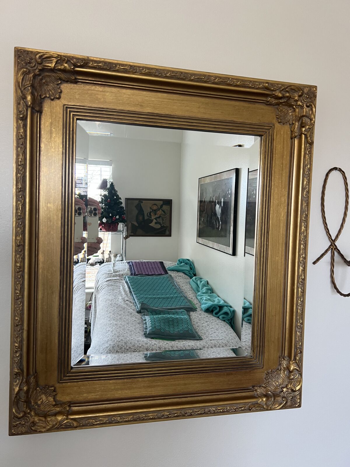 Vintage beveled gold framed mirror.  With frame included measures 28 1/8 x 24 1/8
