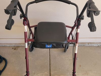 Walker with seat and brakes