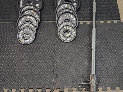 Weights 242 pounds plus barbell