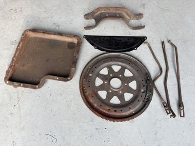 Vintage Auto Parts Lot: Flywheel, Oil Pan, Transmission Cover, kick down rods