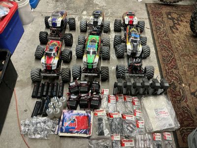 Traxxas T-Maxx Model 4910 Nitro RC Monster Truck Lot - 6 Trucks, Controllers & too many Spare Parts included. Sell together.
