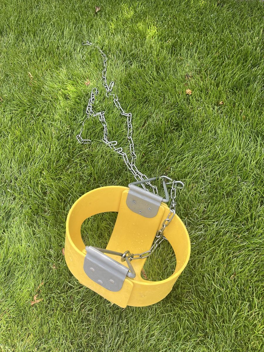 Industrial yellow baby swing with long chains