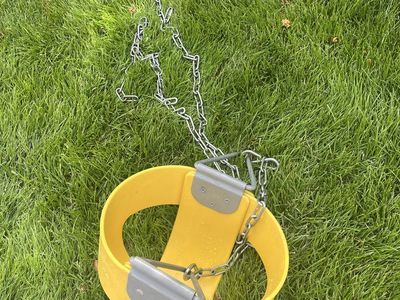 Industrial yellow baby swing with long chains