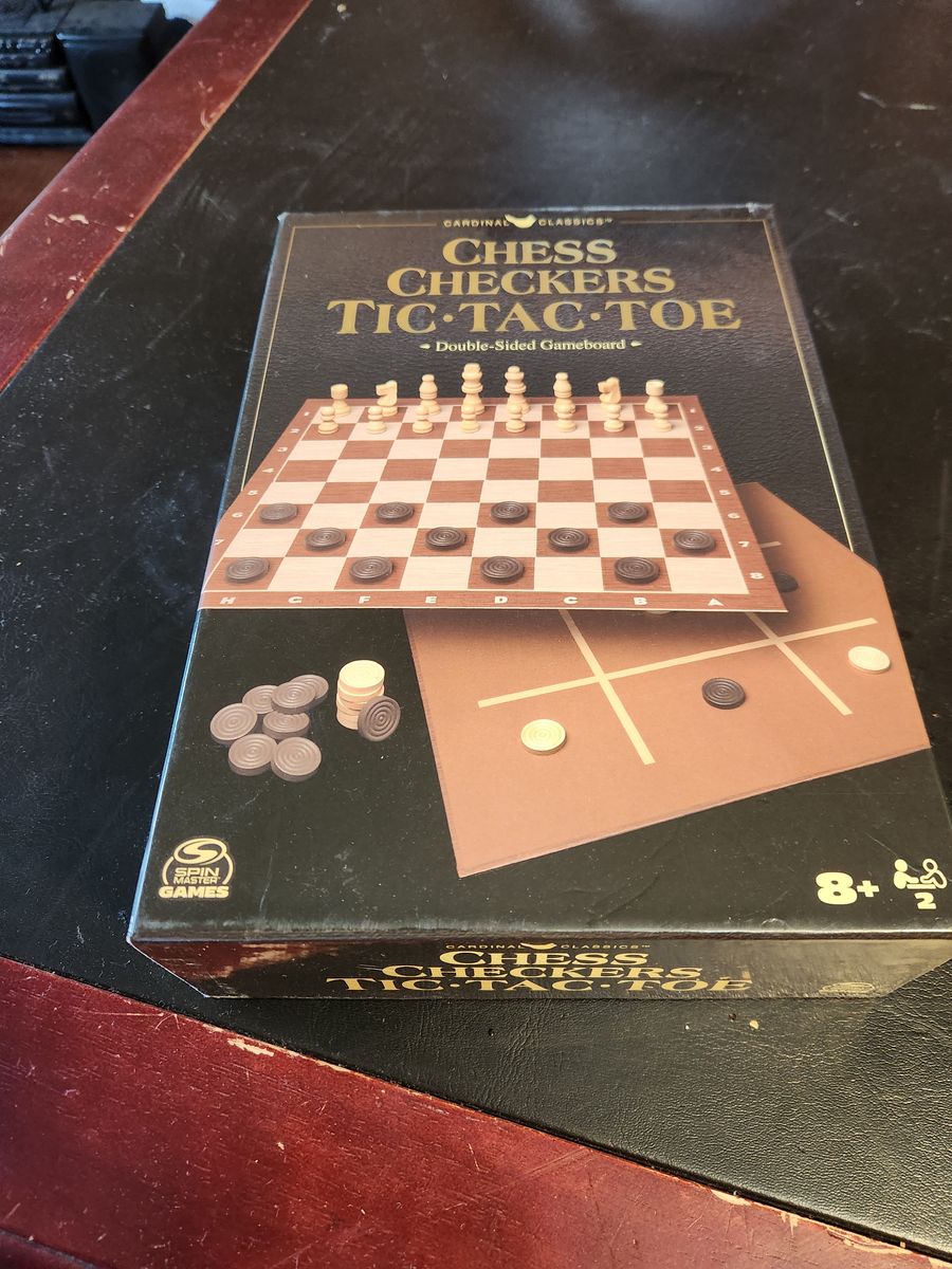 Chess and checkers game board with all pieces.